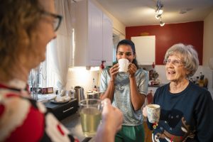 A family chatting in the Kitchen.