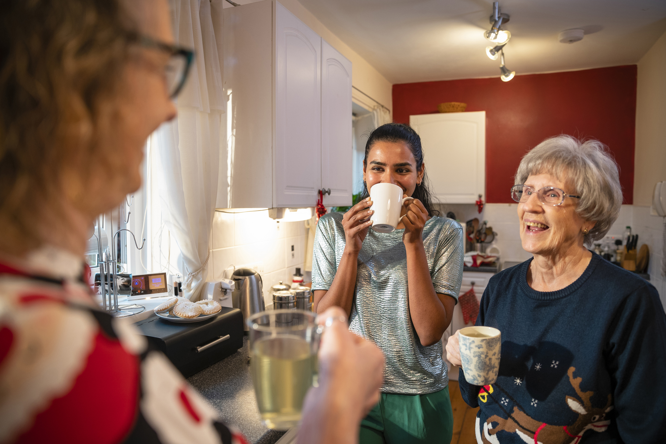 A family chatting in the Kitchen.